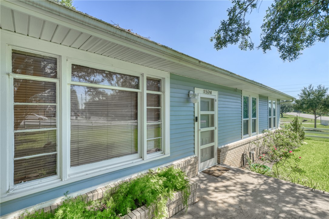1524 Highway 159 Bellville, TX 77418 - Photo 4 of 33 a house with trees in front of it