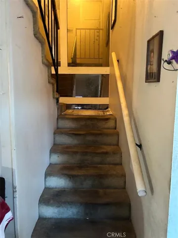 a view of a backyard with sitting area