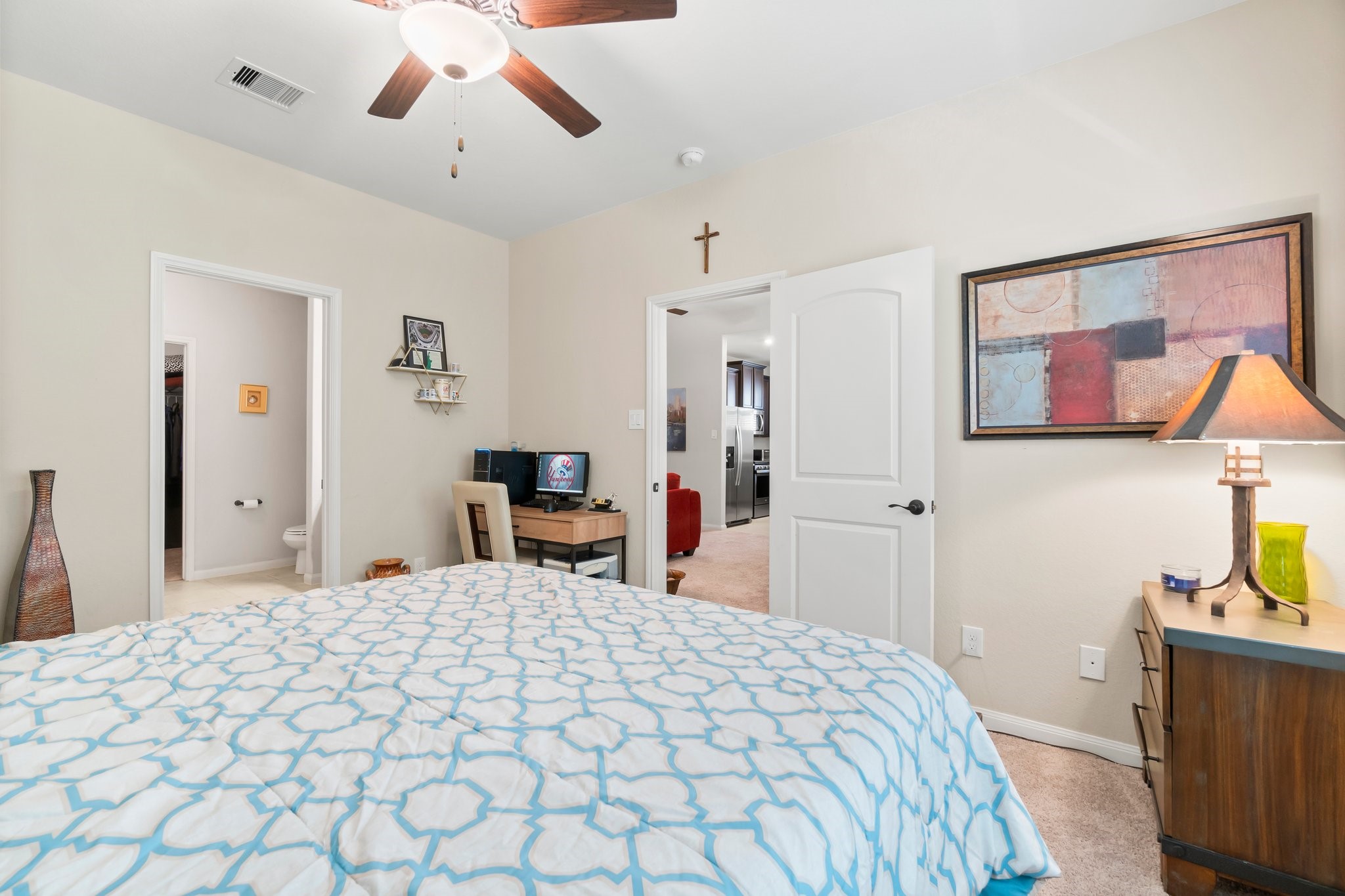 7643 Glaber Leaf Road Conroe, TX 77304 - Photo 12 of 26 Another view of the primary bedroom with your en-suite bathroom.