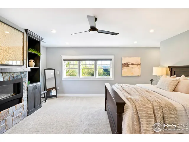 a bedroom with a bed and a fireplace