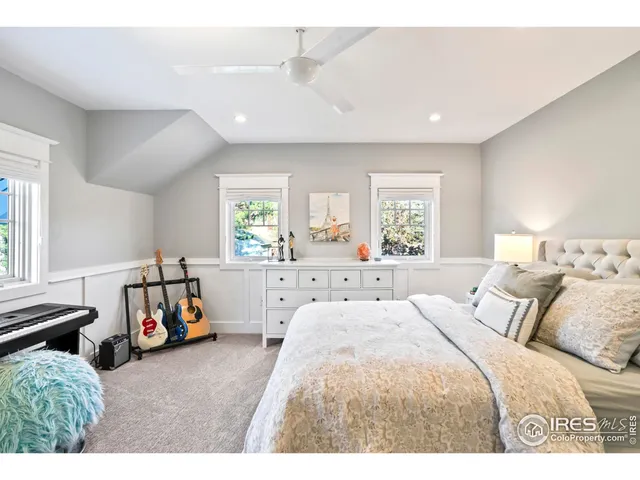 a bedroom with a bed and a couch