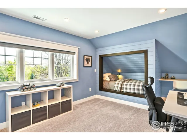 a living room with furniture window and a flat screen tv