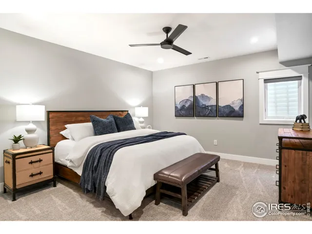 a bedroom with a bed and a night stand