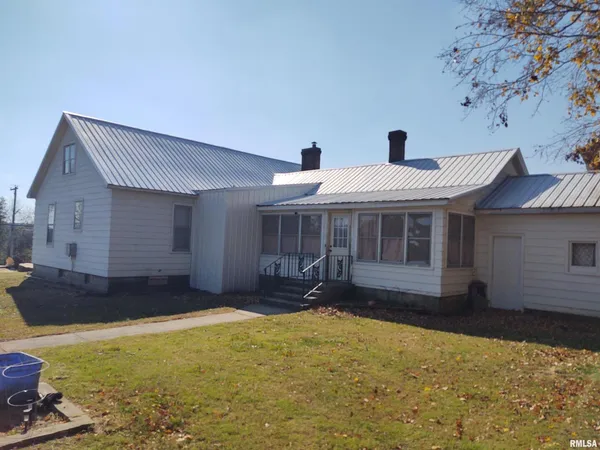 a front view of a house with yard