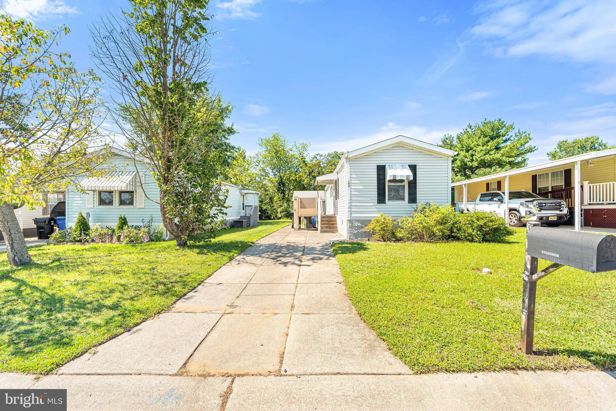 155 Whippoorwill Way Mantua, NJ 08051 - Photo 1 of 23 a front view of a house with garden