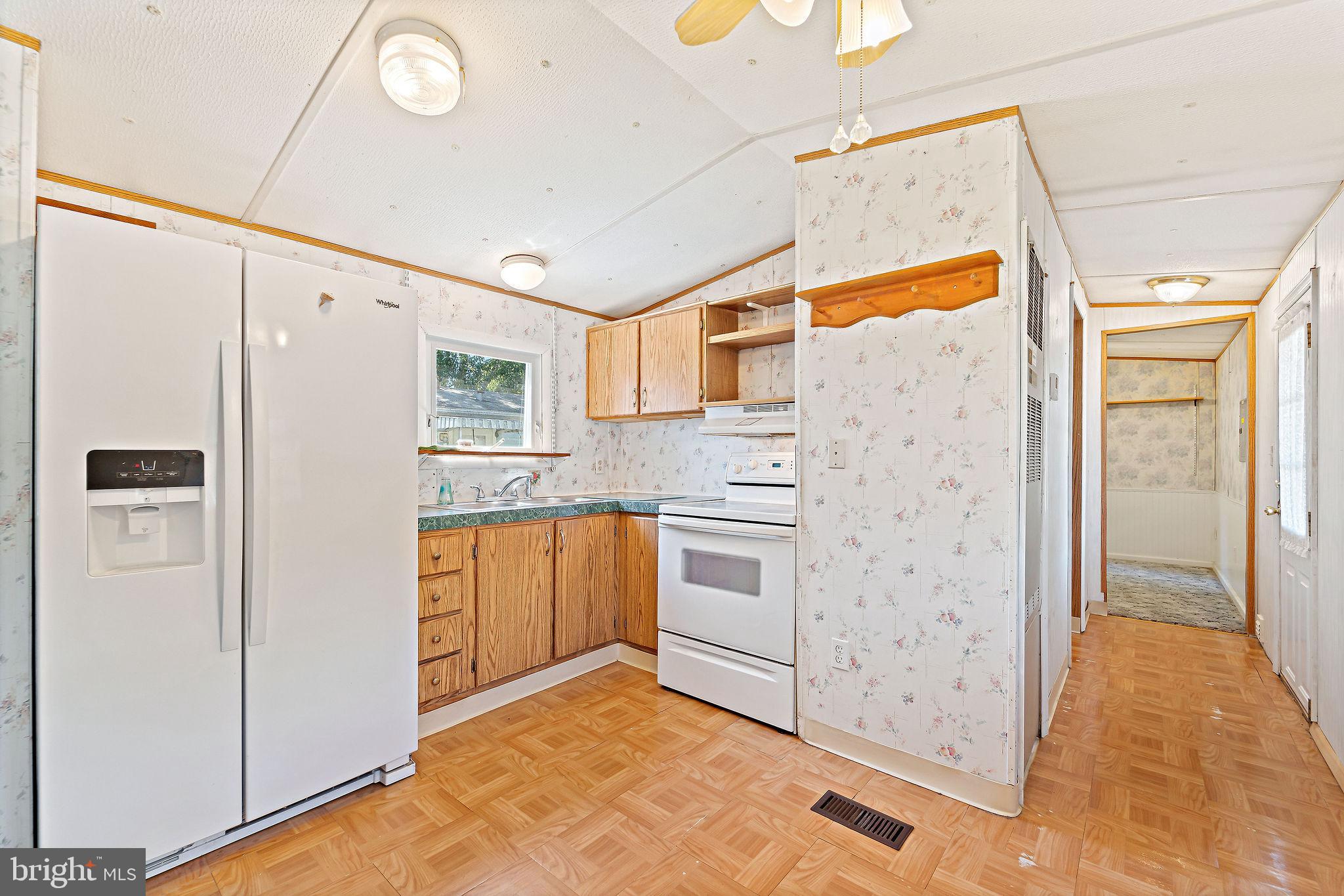 155 Whippoorwill Way Mantua, NJ 08051 - Photo 6 of 23 a kitchen with stainless steel appliances a refrigerator and a stove