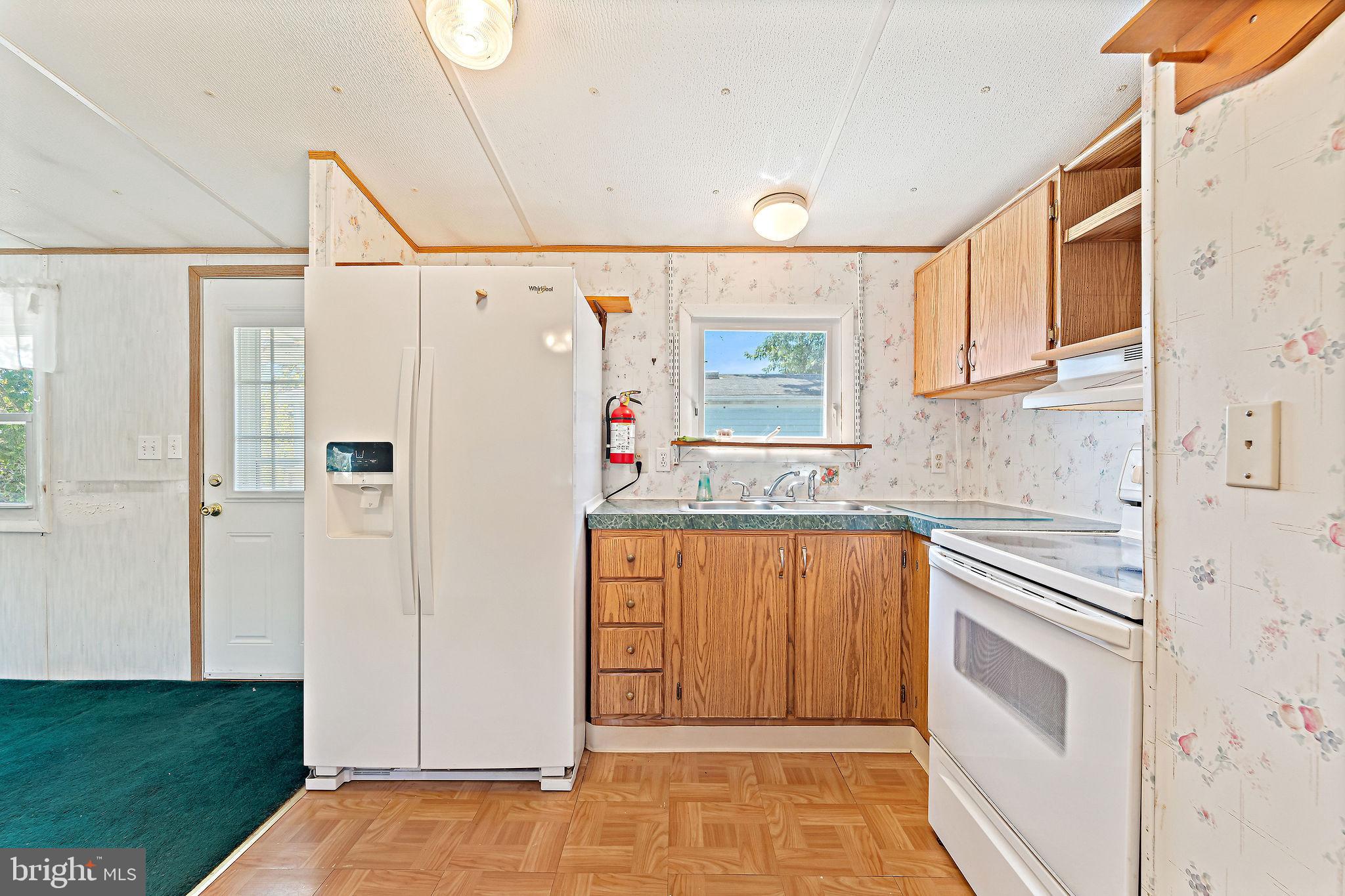 155 Whippoorwill Way Mantua, NJ 08051 - Photo 7 of 23 a kitchen with stainless steel appliances granite countertop a refrigerator and a stove