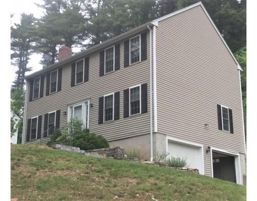46 Fairview Park Road Sturbridge, MA 01566 - Photo 1 of 30 a front view of a house with garden