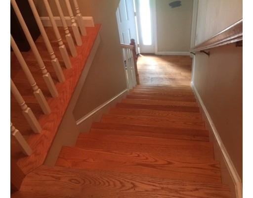 46 Fairview Park Road Sturbridge, MA 01566 - Photo 16 of 30 a view of an empty room with wooden floor and stairs