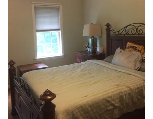 46 Fairview Park Road Sturbridge, MA 01566 - Photo 18 of 30 a bed sitting in a bedroom next to a window