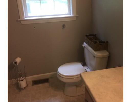 46 Fairview Park Road Sturbridge, MA 01566 - Photo 21 of 30 a white toilet sitting in a bathroom next to a window