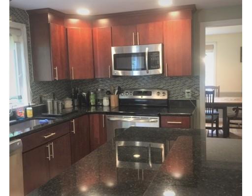 46 Fairview Park Road Sturbridge, MA 01566 - Photo 4 of 30 a kitchen with stainless steel appliances granite countertop a stove a sink and a microwave