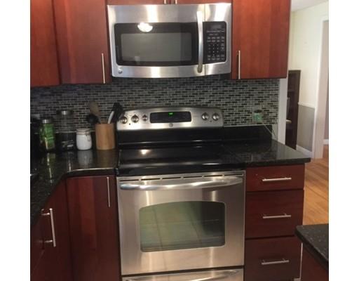 46 Fairview Park Road Sturbridge, MA 01566 - Photo 6 of 30 a stove top oven sitting inside of a kitchen
