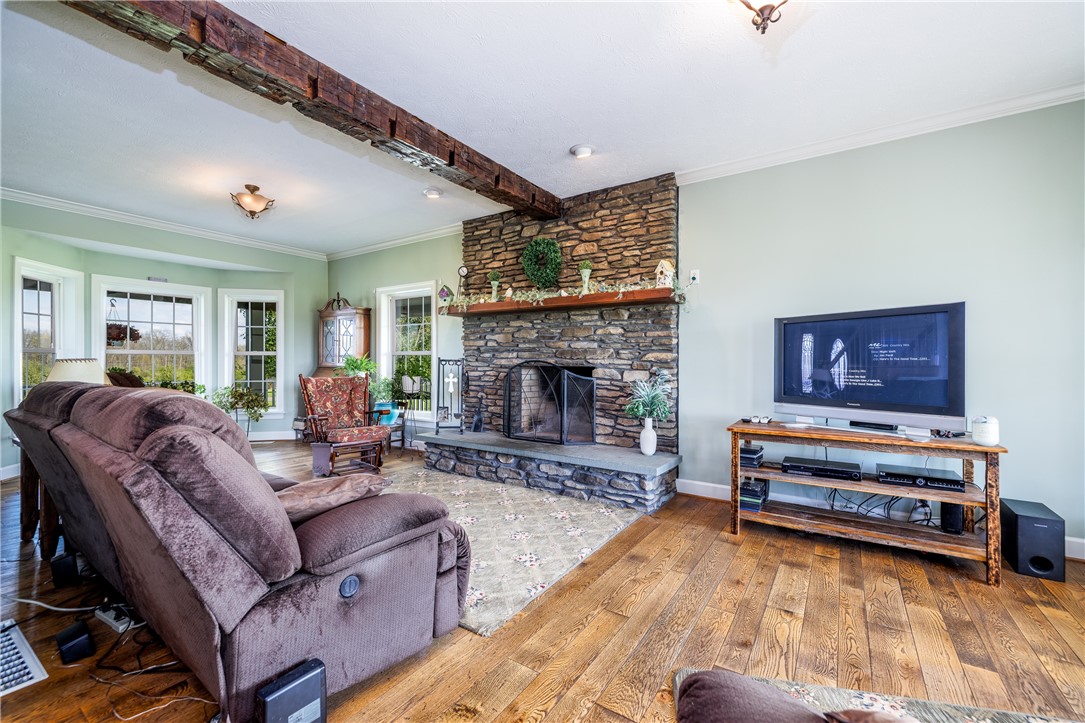 4128 River Road York, NY 14533 - Photo 21 of 50 STONE FIREPLACE GREAT ROOM