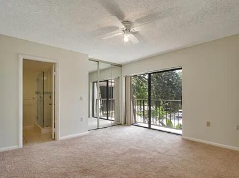 1403 14th Court Jupiter, FL 33477 - Photo 15 of 25 an empty room with windows and closet