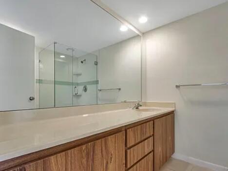 1403 14th Court Jupiter, FL 33477 - Photo 17 of 25 a bathroom with a sink and a mirror