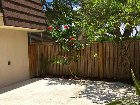 1403 14th Court Jupiter, FL 33477 - Photo 18 of 25 a view of tree in front of a door