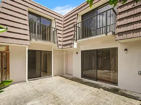1403 14th Court Jupiter, FL 33477 - Photo 5 of 25 a view of a house with a door and wooden walls