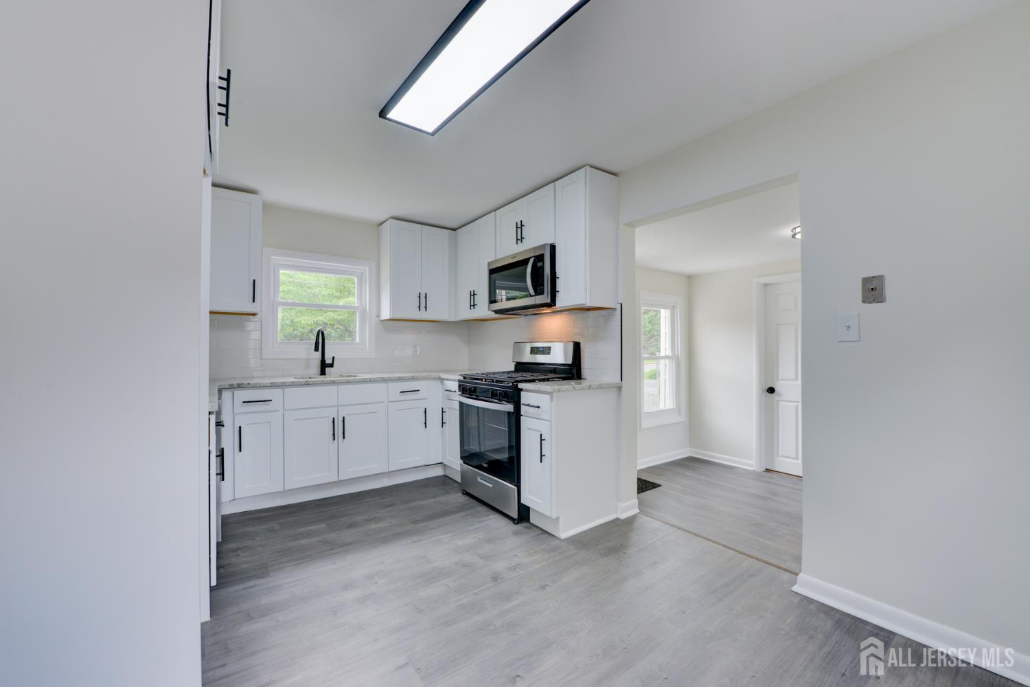6 Main Street Helmetta, NJ 08828 - Photo 11 of 27 a kitchen with sink cabinets and stainless steel appliances