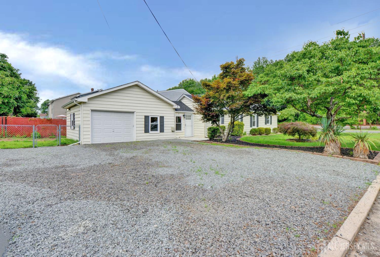 6 Main Street Helmetta, NJ 08828 - Photo 3 of 27 a front view of house with yard and green space
