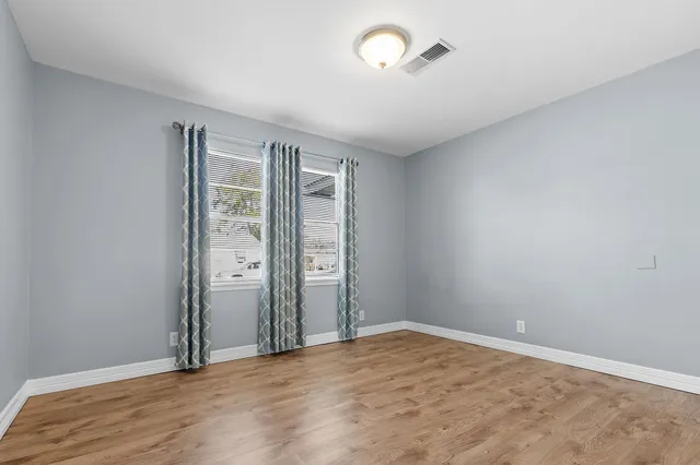 an empty room with windows