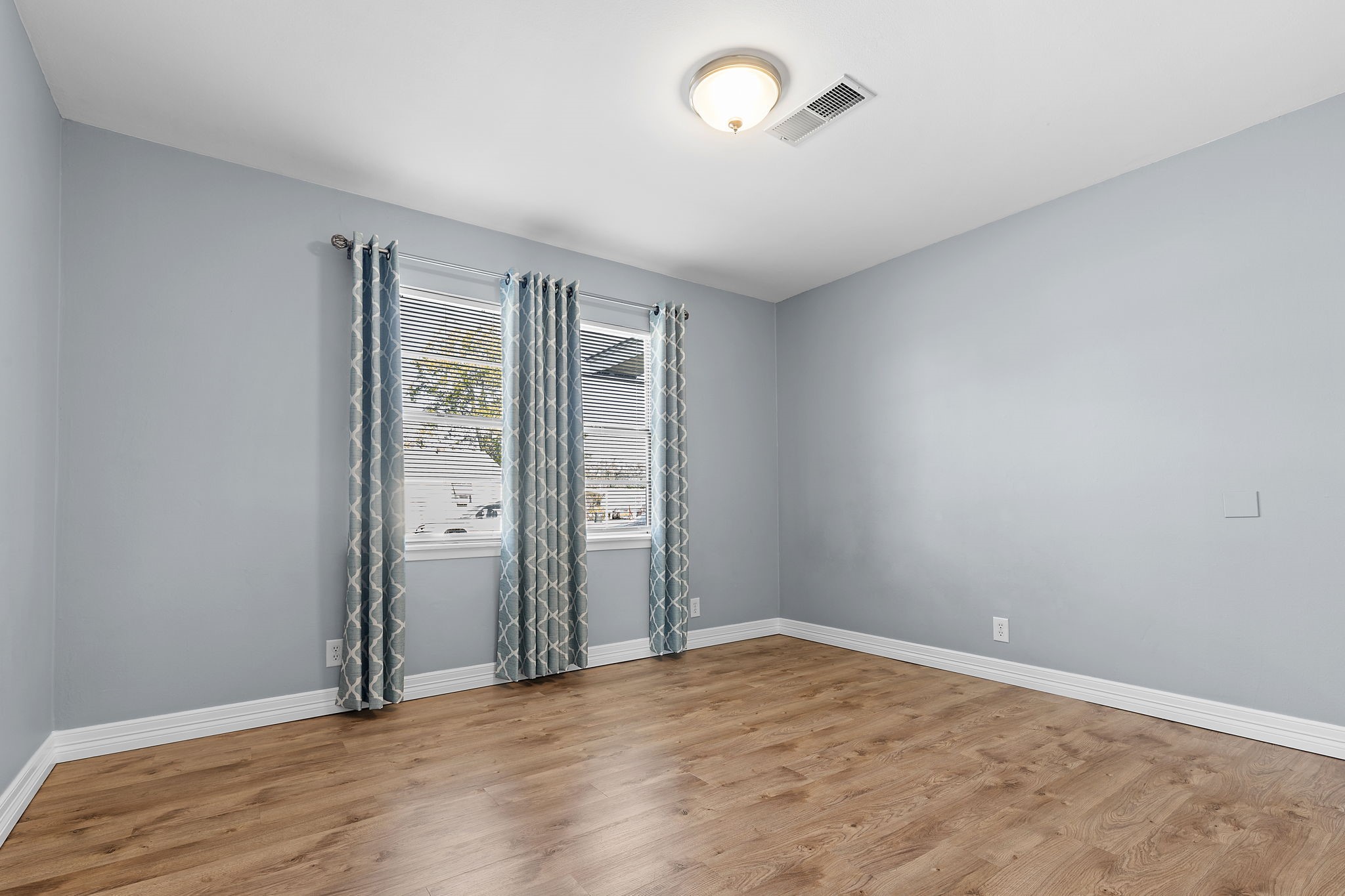 1051 Ave A Bacliff, TX 77518 - Photo 11 of 20 an empty room with windows