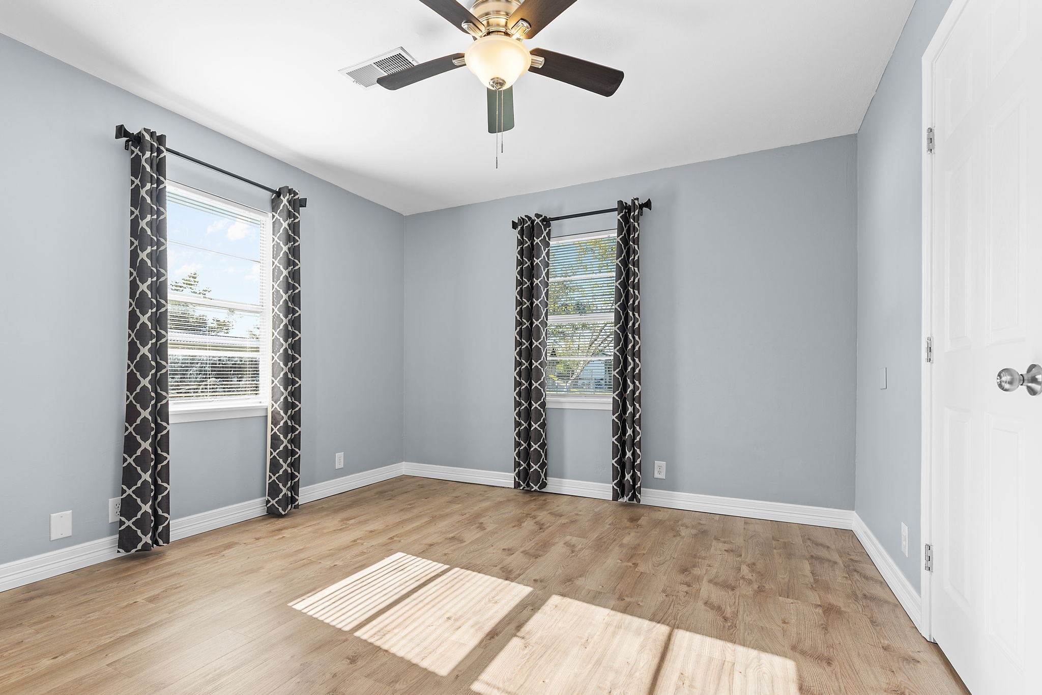 1051 Ave A Bacliff, TX 77518 - Photo 14 of 20 wooden floor in an empty room with a window