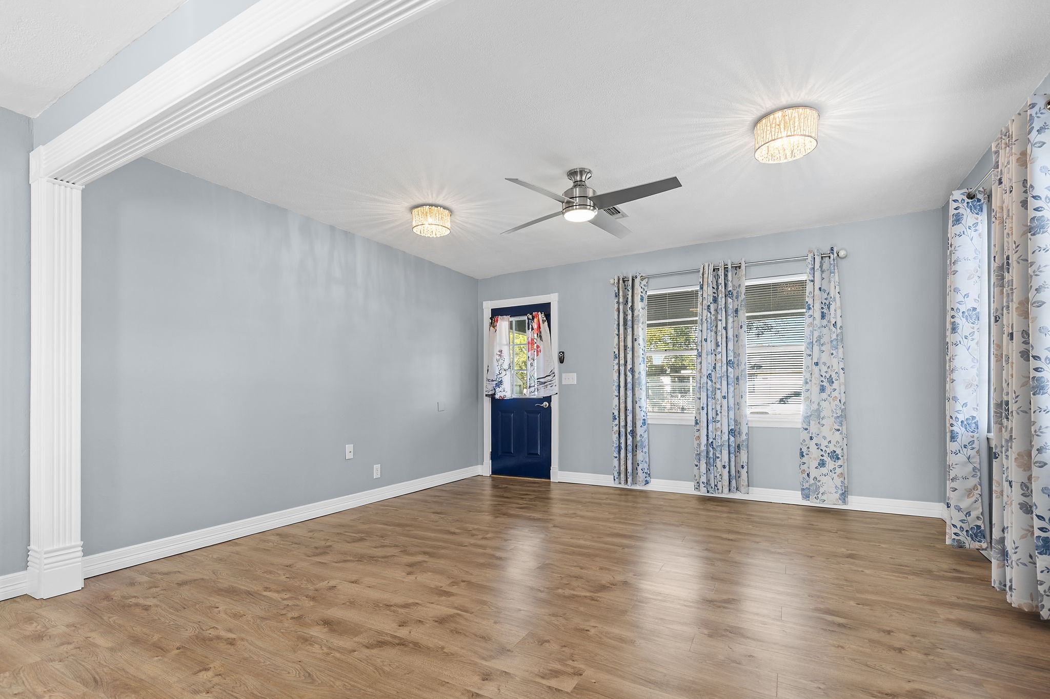 1051 Ave A Bacliff, TX 77518 - Photo 16 of 20 a view of an empty room with window and wooden floor