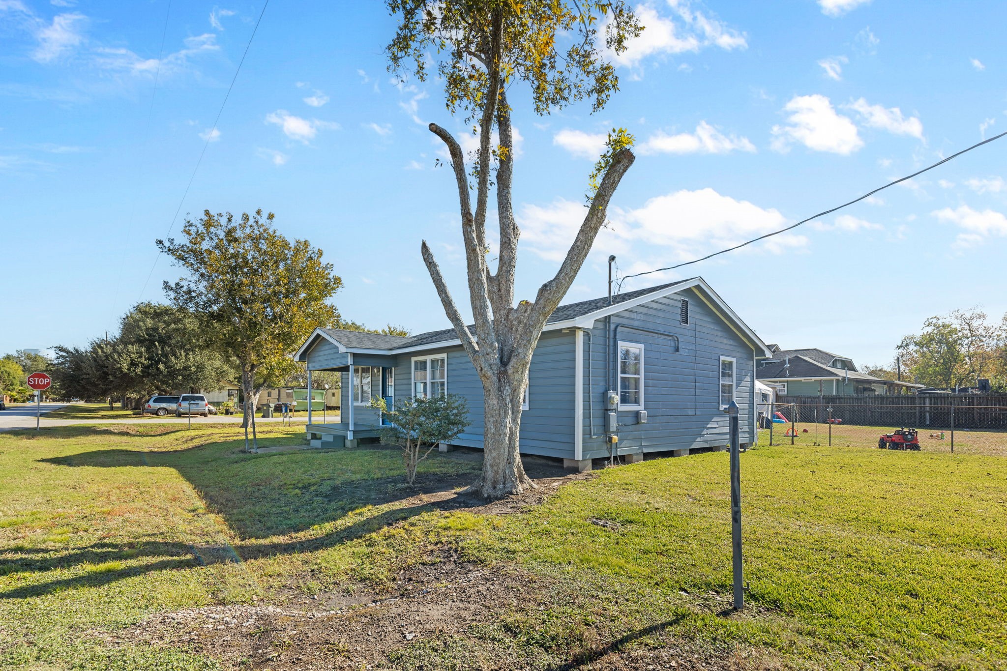 1051 Ave A Bacliff, TX 77518 - Photo 18 of 20 a view of a house with a yard