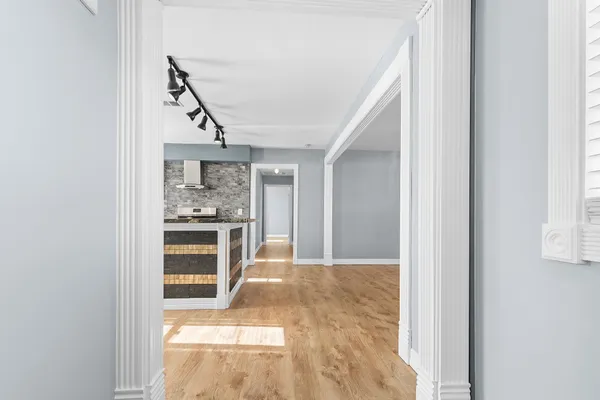 a view of a kitchen cabinets and a window