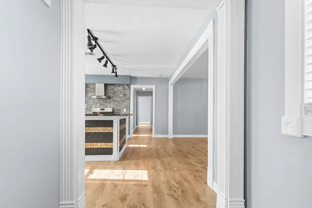 a view of a kitchen cabinets and a window
