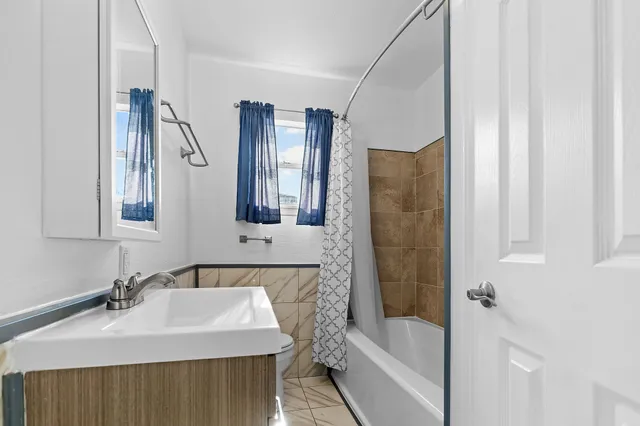 a bathroom with a bathtub and a sink