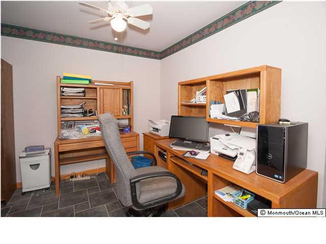 641 Hulses Corner Road Howell, NJ 07731 - Photo 12 of 21 a room with furniture and a flat screen tv