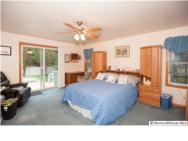 641 Hulses Corner Road Howell, NJ 07731 - Photo 13 of 21 a living room with furniture and a fireplace