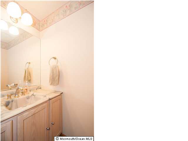 641 Hulses Corner Road Howell, NJ 07731 - Photo 16 of 21 a bathroom with a sink and a mirror