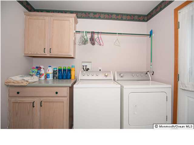 641 Hulses Corner Road Howell, NJ 07731 - Photo 17 of 21 a utility room with dryer and washer