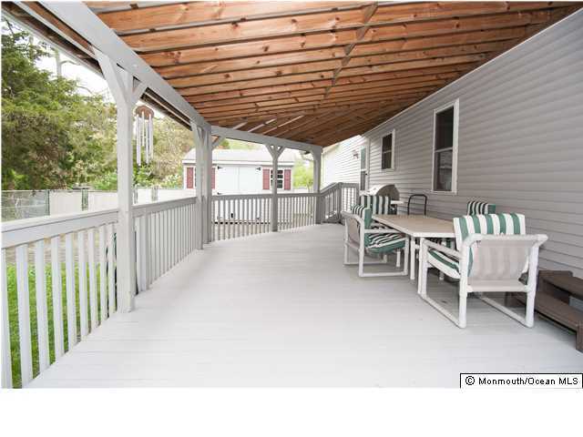 641 Hulses Corner Road Howell, NJ 07731 - Photo 20 of 21 a balcony with table and chairs