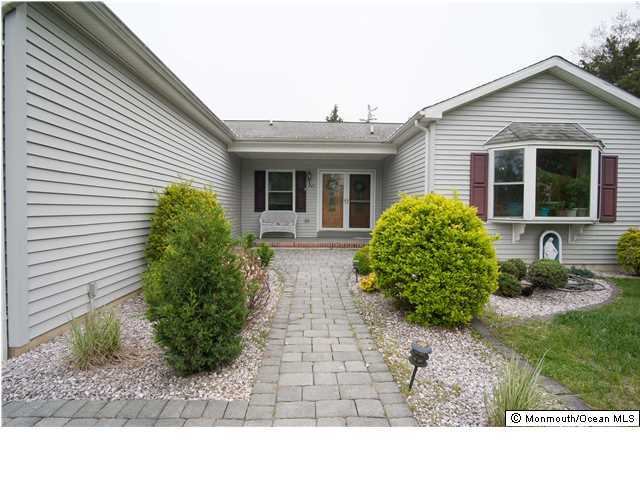 641 Hulses Corner Road Howell, NJ 07731 - Photo 3 of 21 a front view of house with yard and outdoor seating