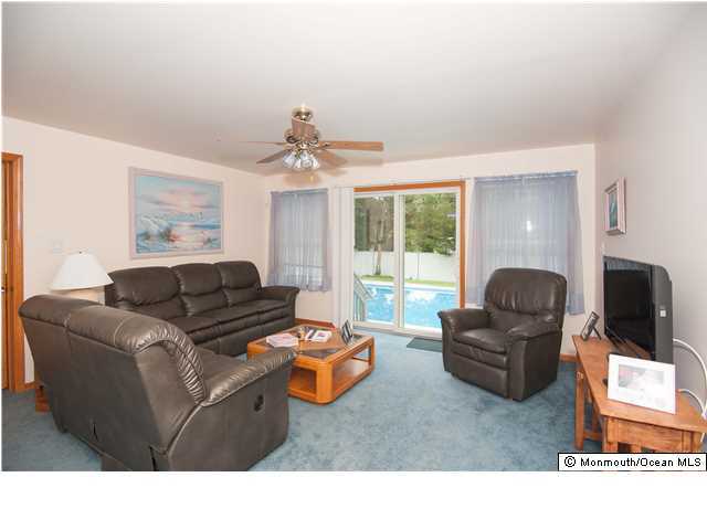 641 Hulses Corner Road Howell, NJ 07731 - Photo 7 of 21 a living room with furniture flat screen tv and window