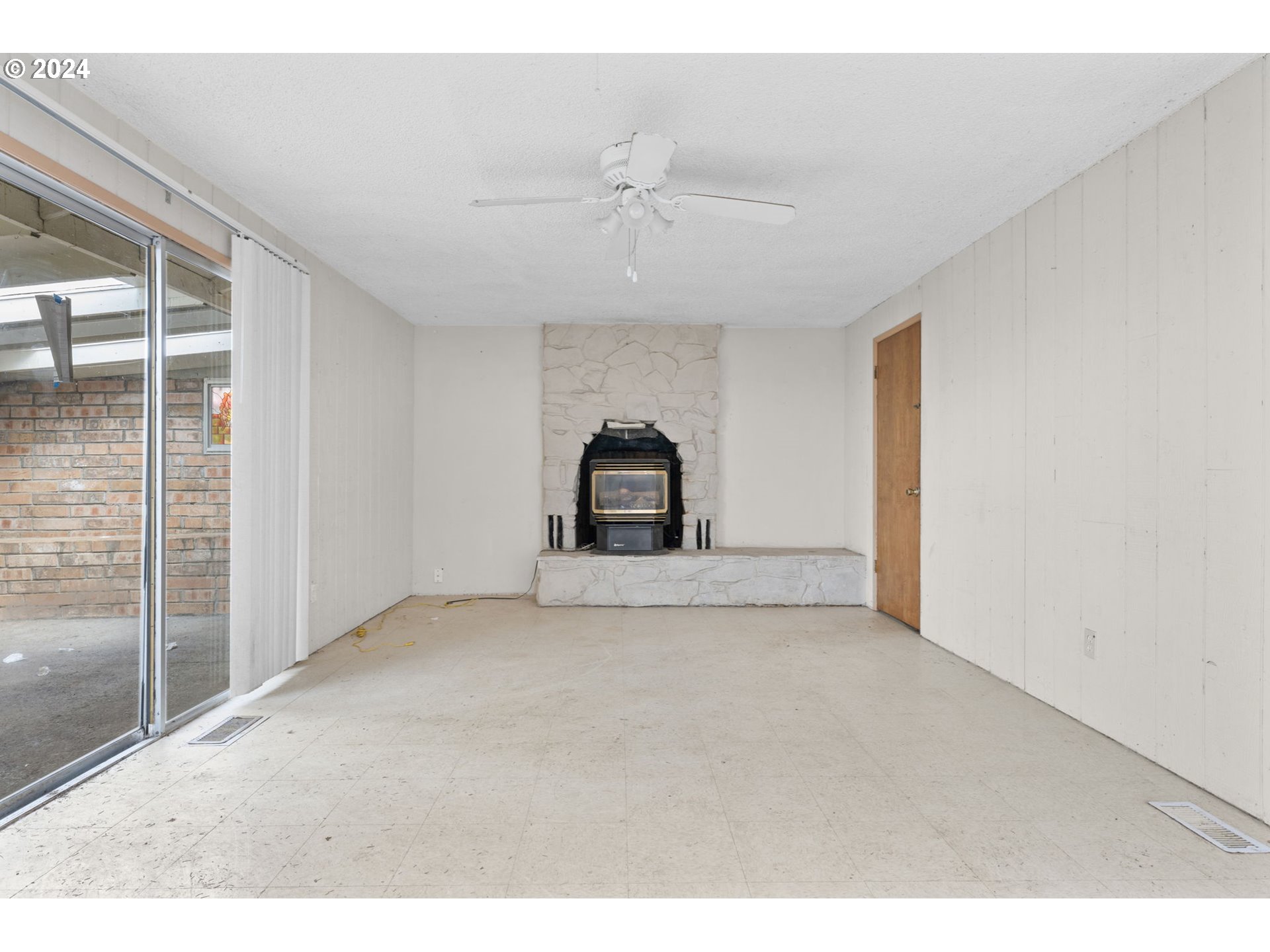 8707 Southeast Cottrell Road Boring, OR 97009 - Photo 8 of 44 a view of a big room with wooden floor and windows