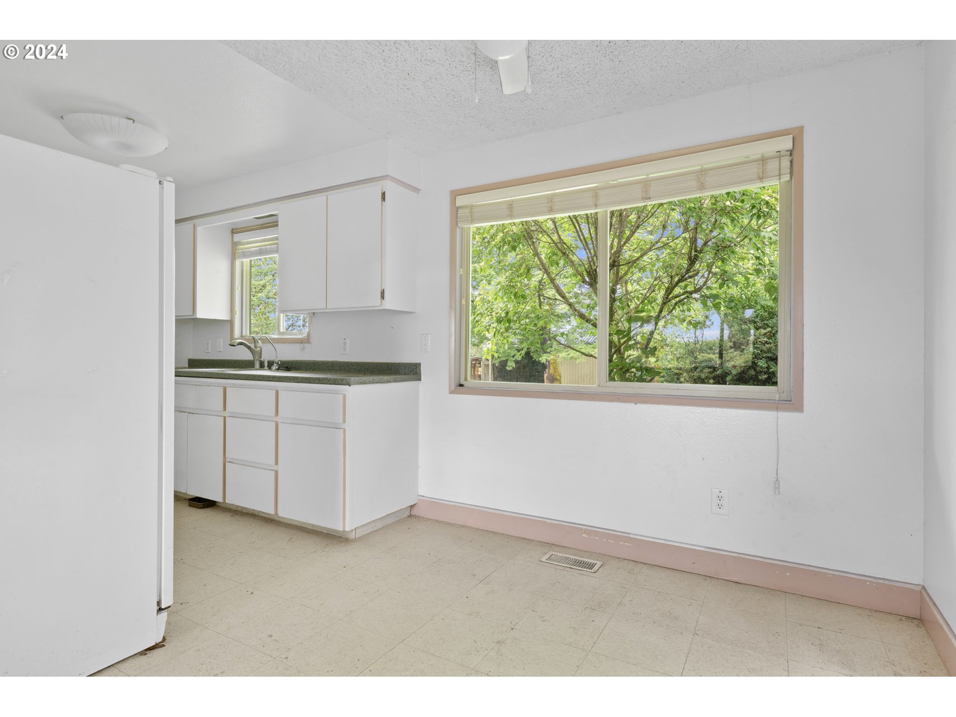 8707 Southeast Cottrell Road Boring, OR 97009 - Photo 10 of 44 a kitchen with a stove a sink and a window