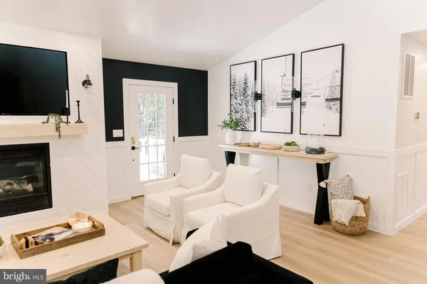 a bathroom with a sink vanity and a toilet