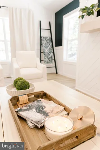 a view of living room with furniture and window