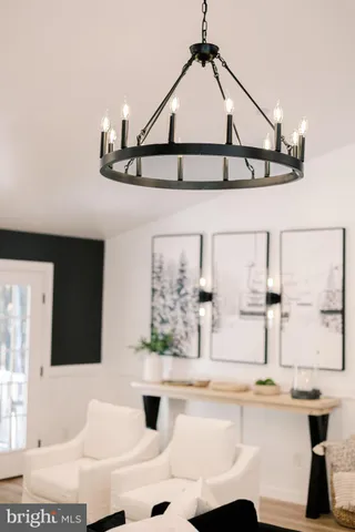 a view of a lush green forest with trees and some houses