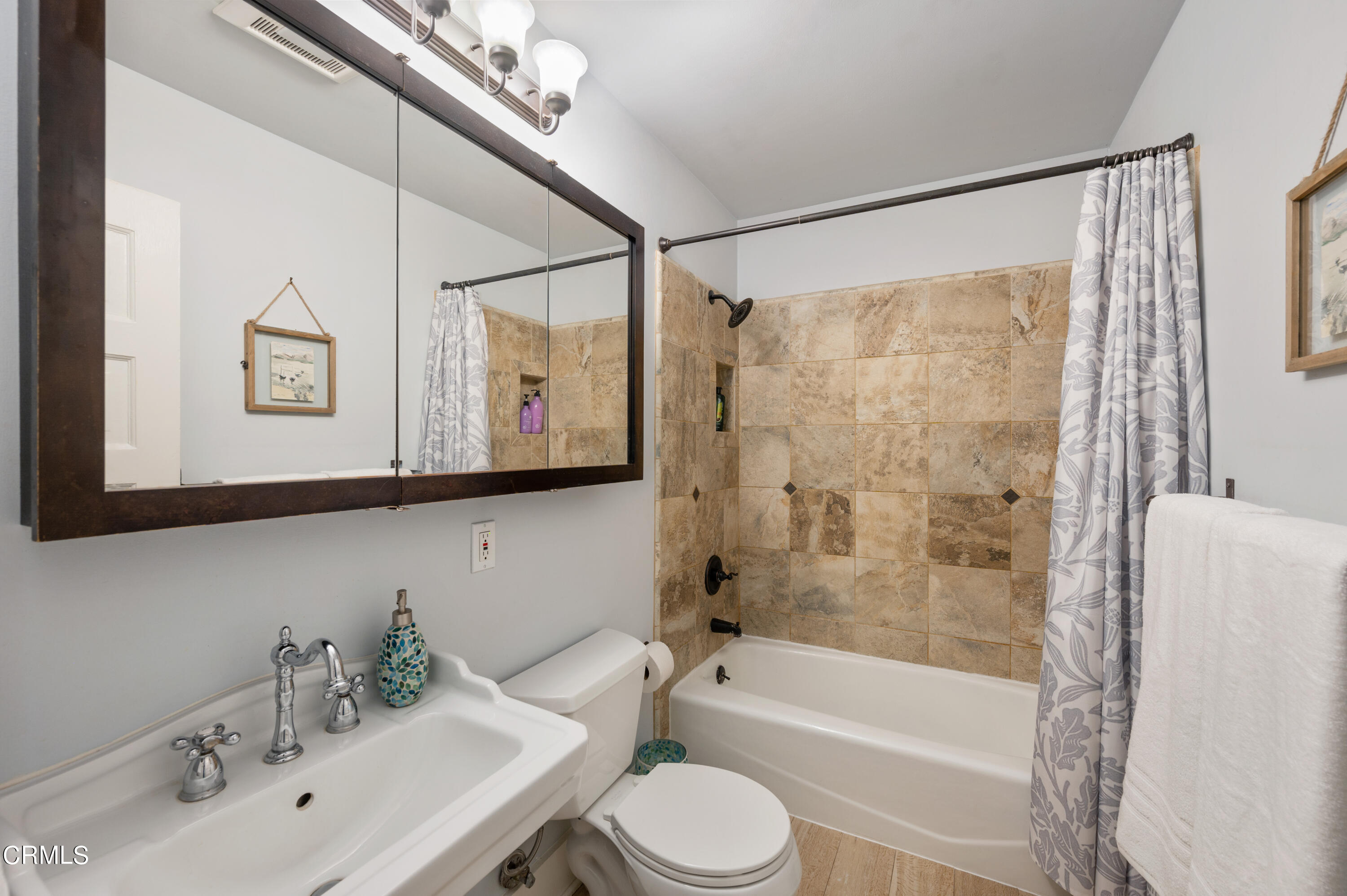 1265 North Wilson Avenue Pasadena, CA 91104 - Photo 18 of 48 a bathroom with a bathtub shower sink vanity and toilet