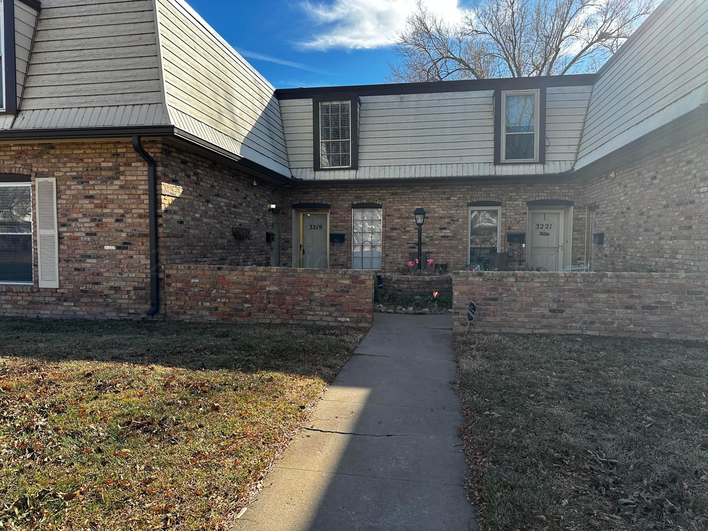 3219 Villa Place Amarillo, TX 79109 - Photo 1 of 13 a front view of a house with a brick wall