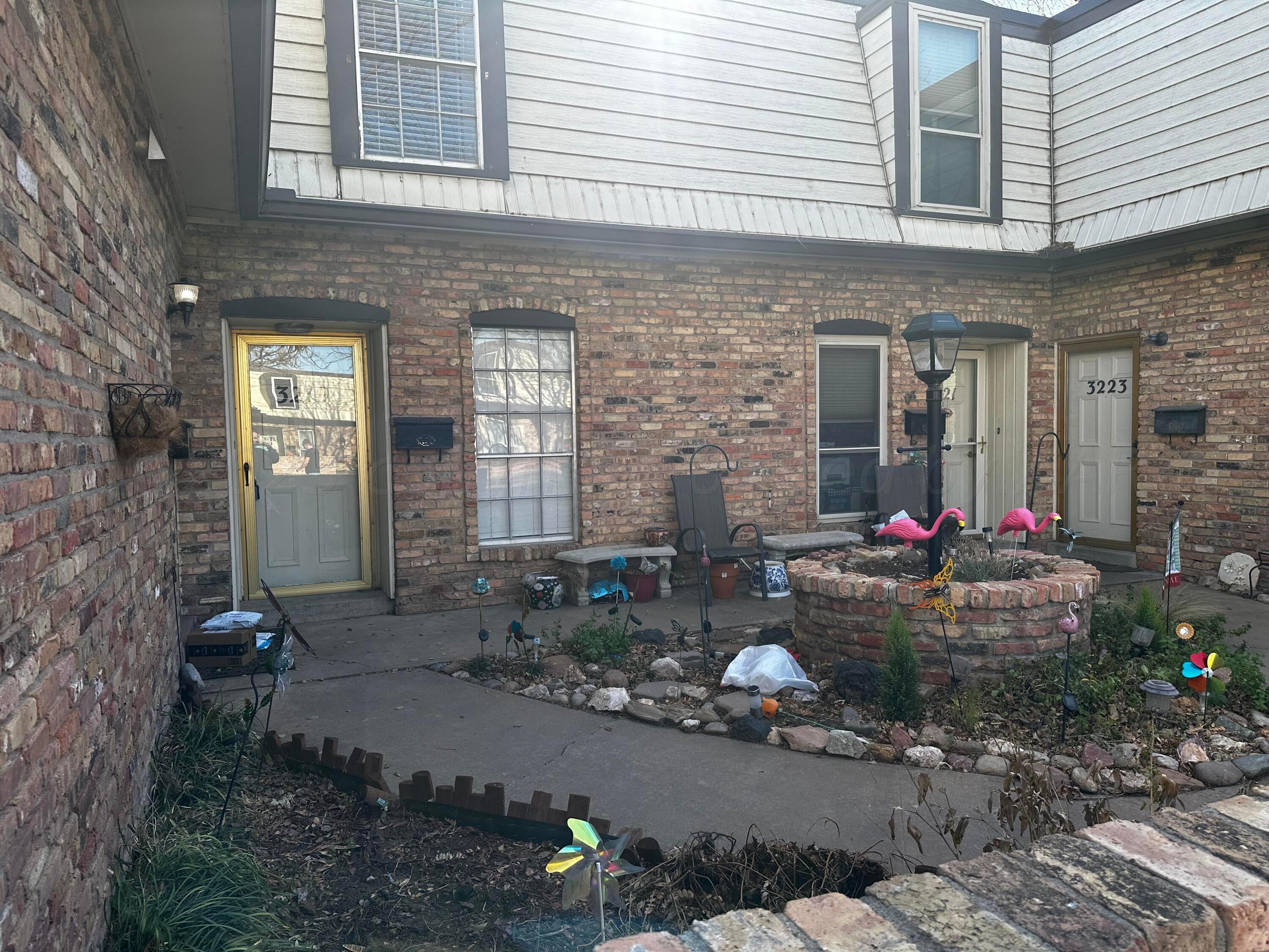 3219 Villa Place Amarillo, TX 79109 - Photo 2 of 13 a group of people sitting in front of a house