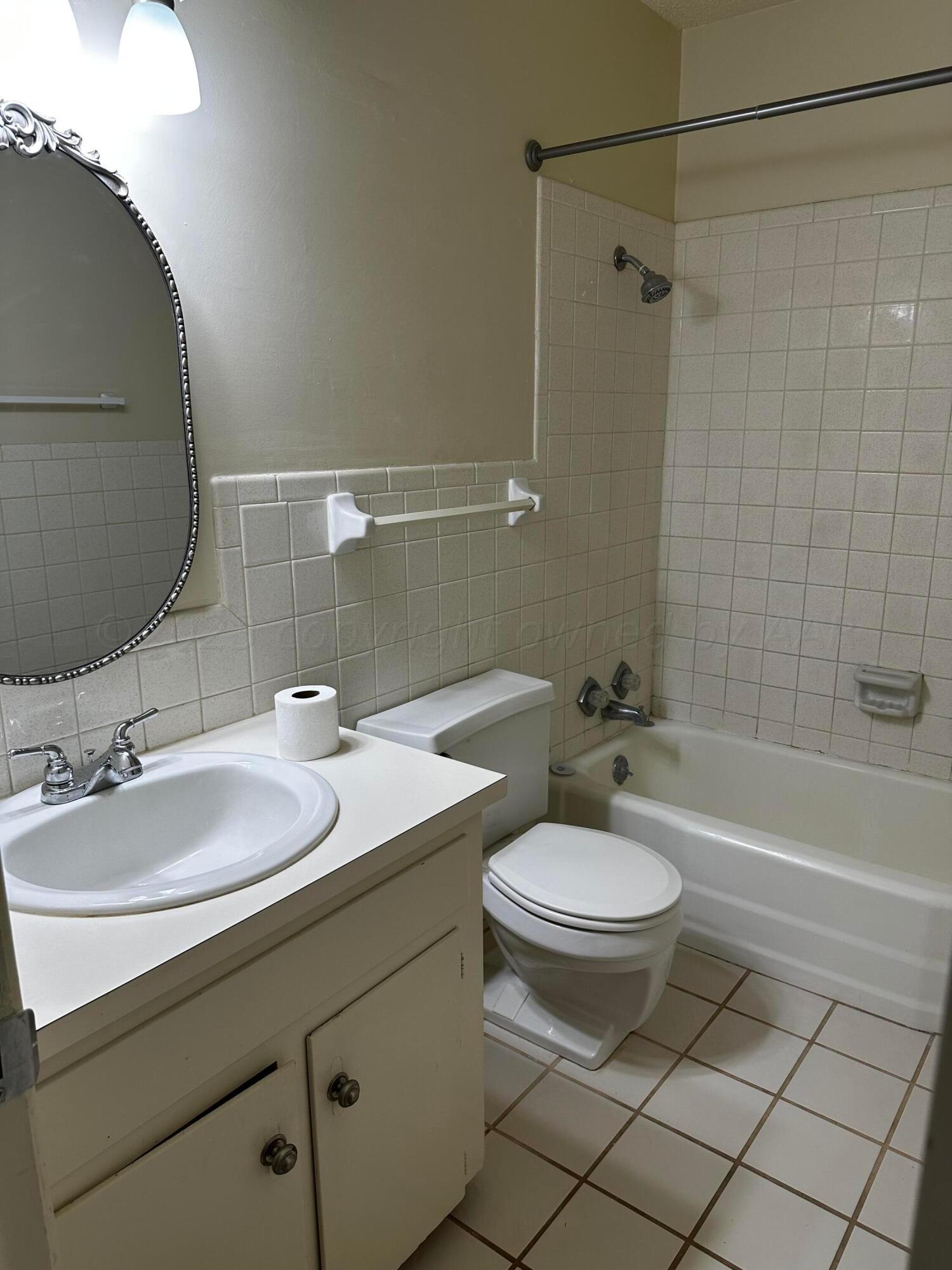 3219 Villa Place Amarillo, TX 79109 - Photo 7 of 13 a bathroom with a sink toilet and shower