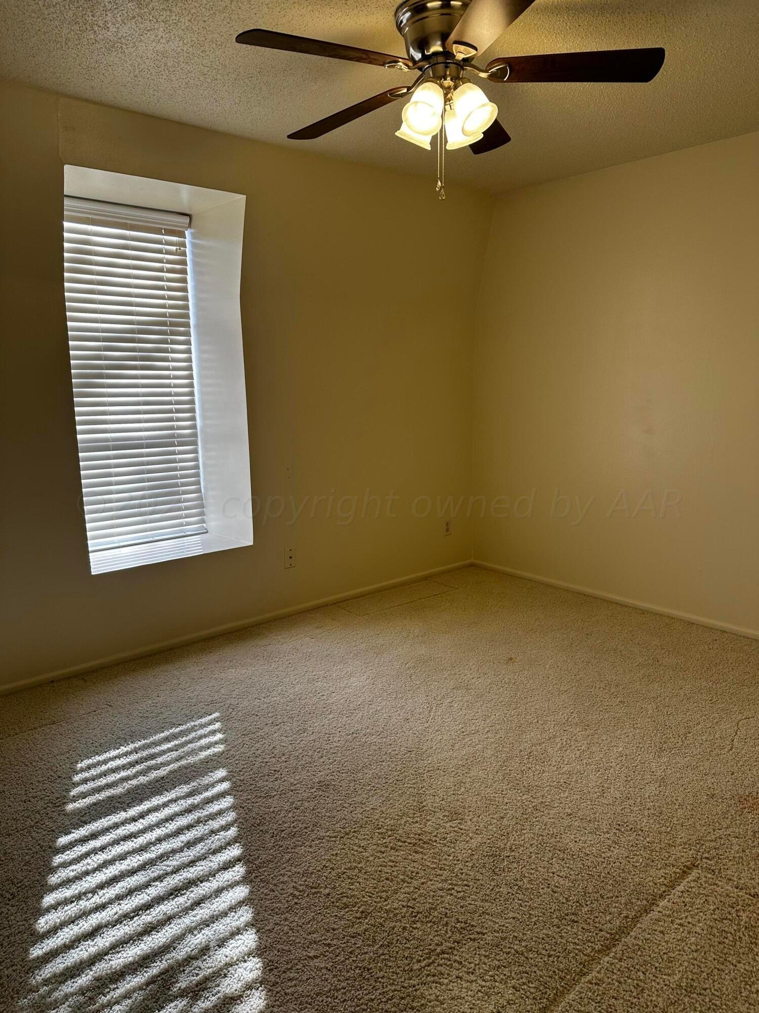 3219 Villa Place Amarillo, TX 79109 - Photo 8 of 13 a view of an empty room with a window