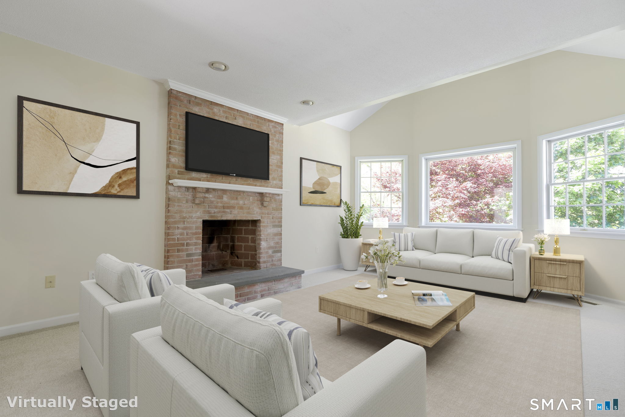 555 Waterville Road Avon, CT 06001 - Photo 15 of 40 a living room with furniture a flat screen tv and a fireplace